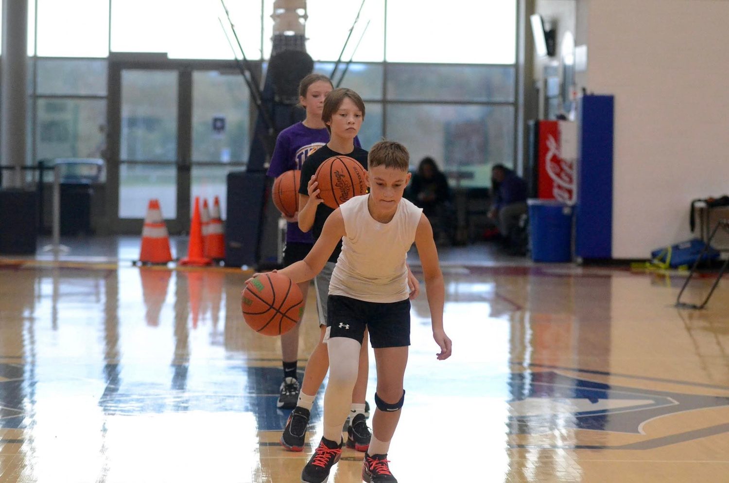Players working through a ball-handling drill at TC3 Basketball