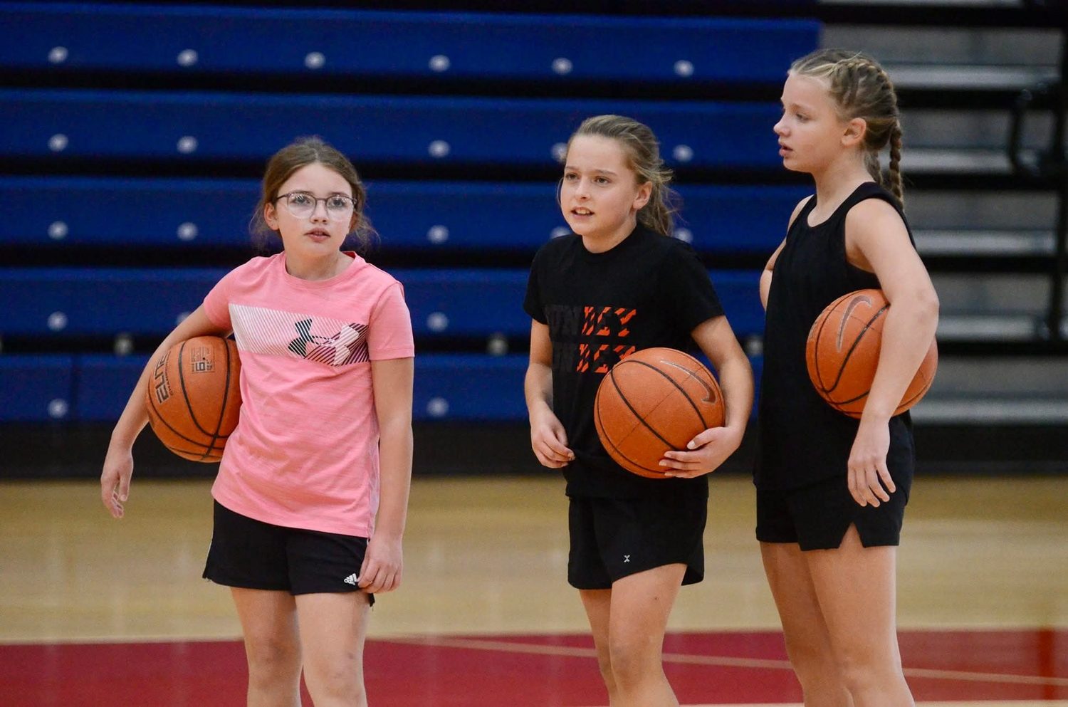 Young athletes with basketballs during a TC3 group training session